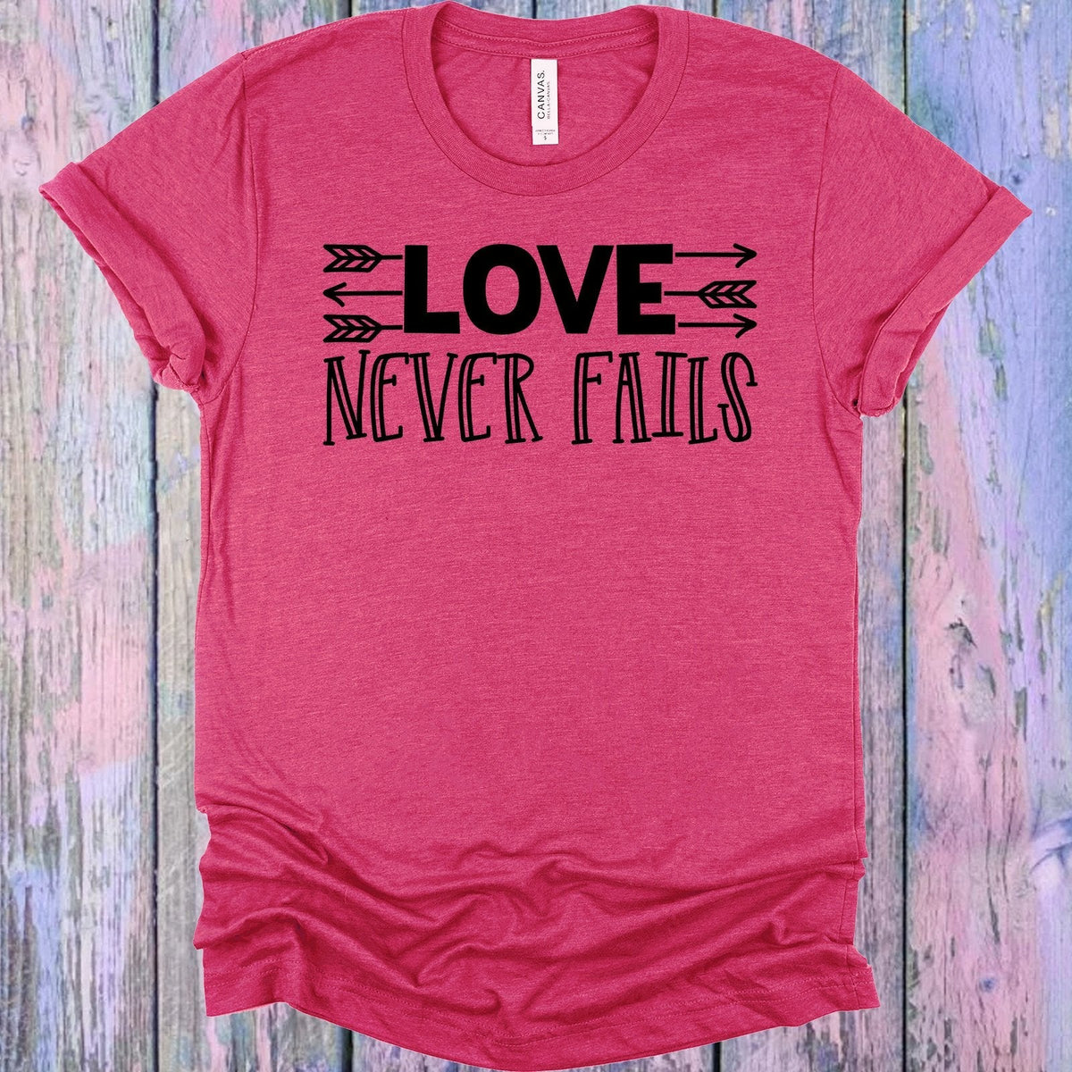 Love Never Fails Graphic Tee product image 1